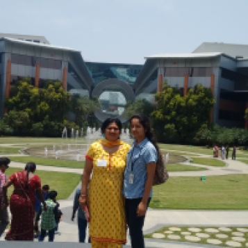 Showing around the campus to mom - the washing machine building just behind us.